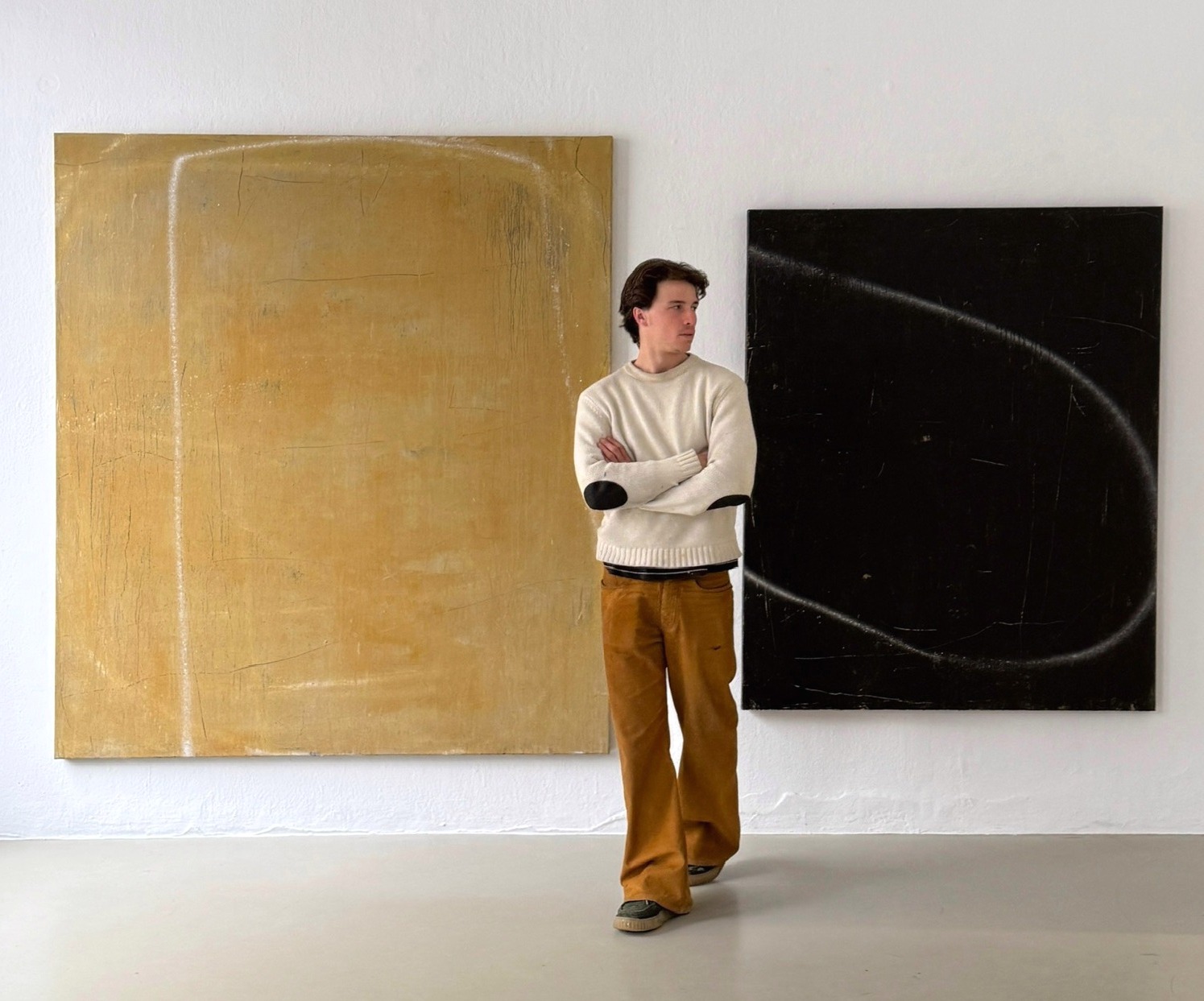 Enrich. R in front of his works